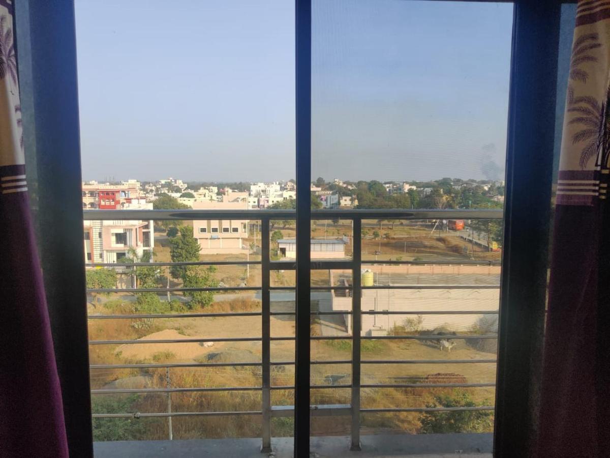 Hotel Hariram Tower Wardha Oda fotoğraf